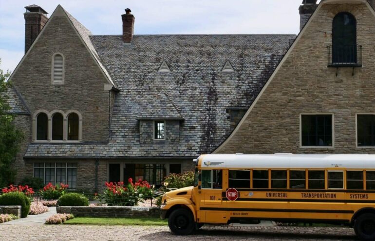 school bus in front of arts center