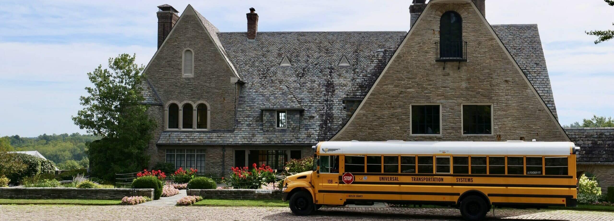 school bus in front of arts center